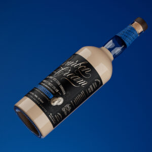 Doc Brown Farm and Distillers Salted Caramel Bourbon Cream bottle blue background